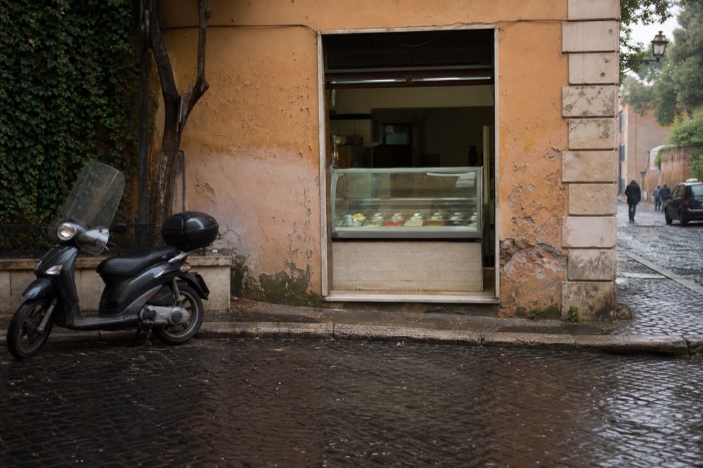 A gelato counter with a short list of natural-coloured flavours in Rome