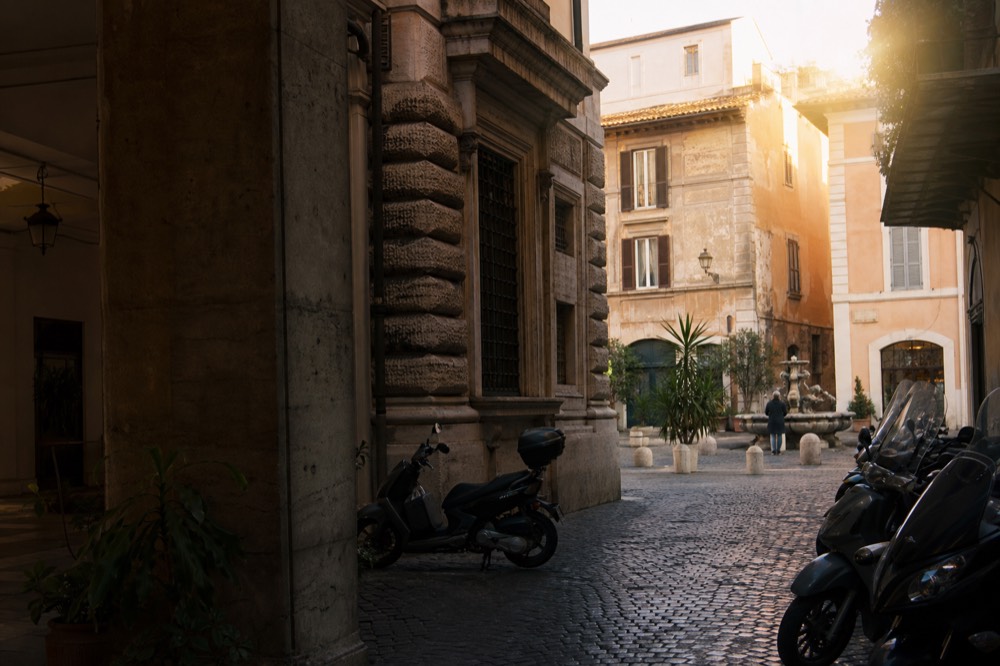 A Rome street corner near Piazza Navona in late afternoon light
