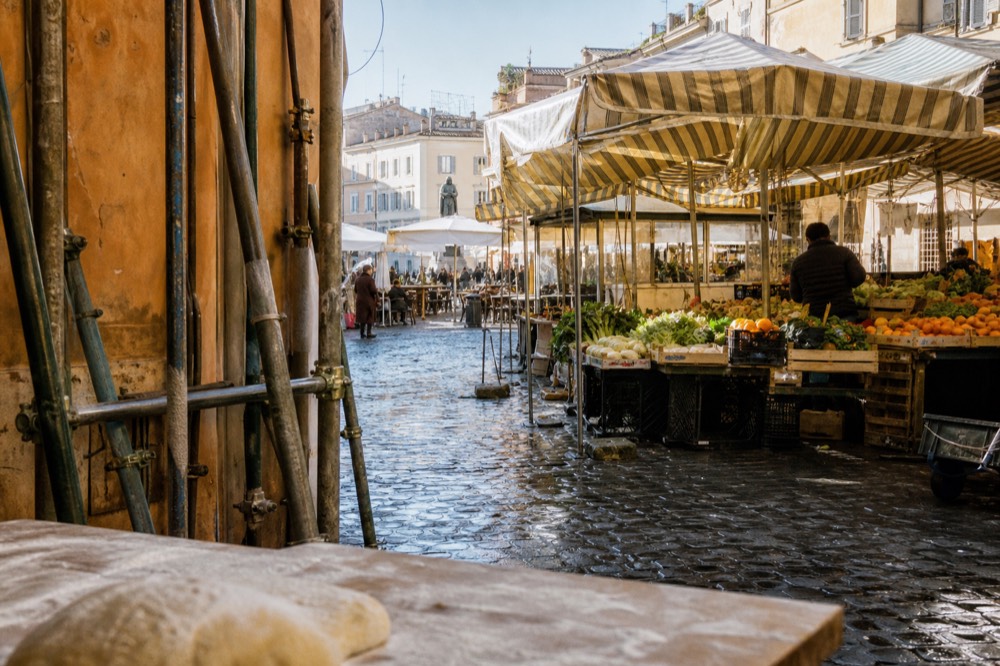 A Rome market square in morning light with stalls and awnings