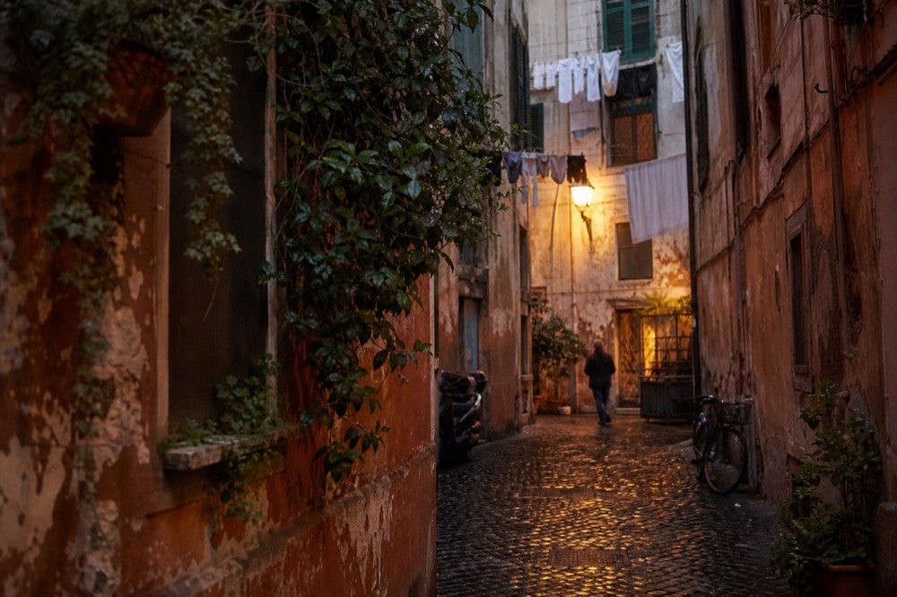 A lantern-lit alley in Trastevere in the evening