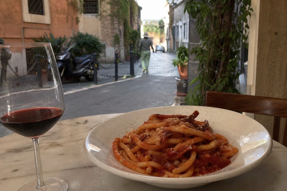 A bowl of bucatini all'amatriciana with guanciale and tomato