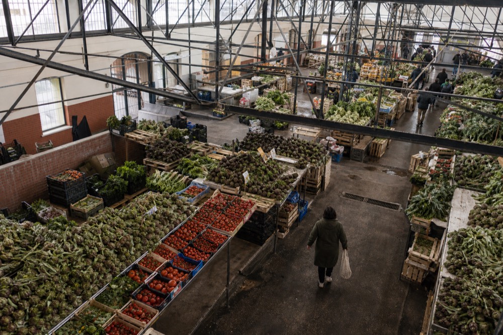 The covered Nuovo Mercato Testaccio interior with produce stalls